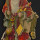 Santa with toys and red hooded cape.